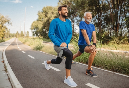 two men stretching before a run